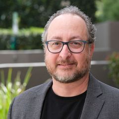 Image of man from chest up standing while looking at camera. he is Mike Dobbs from Mike dobbs real estate